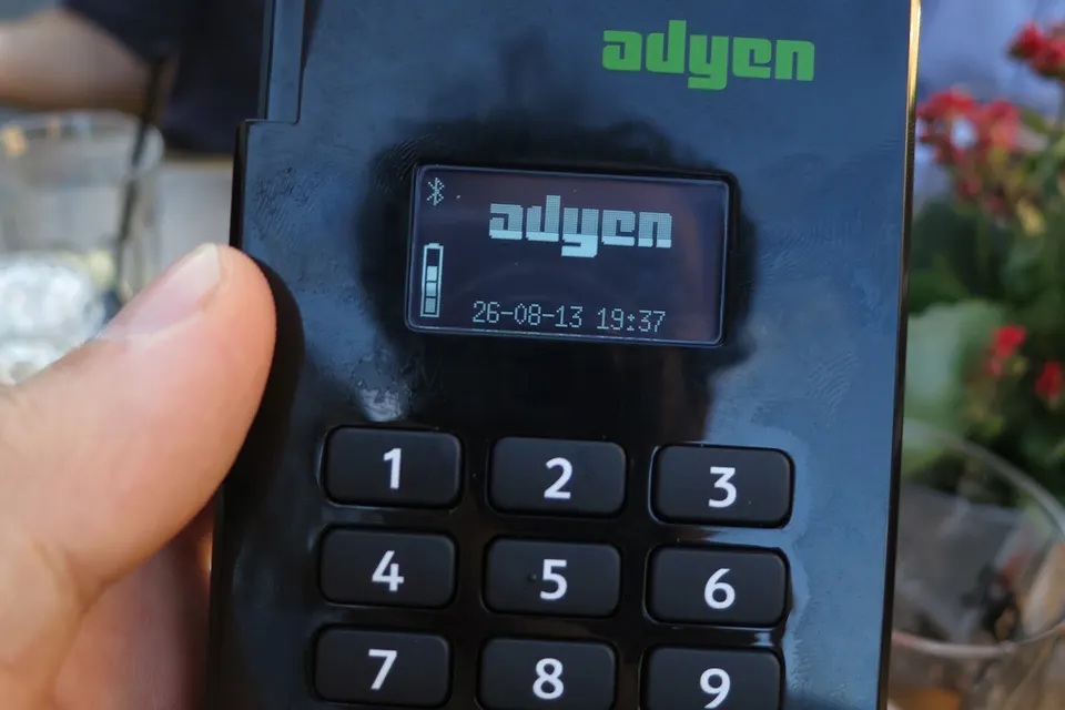 A card payment terminal on a counter
